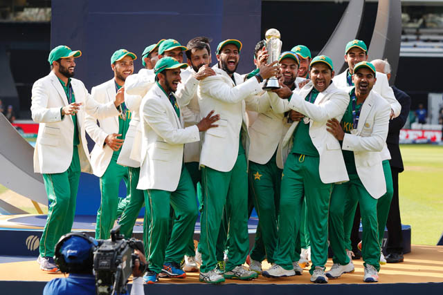 Pakistan's Sarfraz Ahmed  lifts the trophy as Pakistan players celebrate their win at the presentation after the ICC Champions Trophy final cricket match between India and Pakistan at The Oval in London on Sunday (AFP photo)