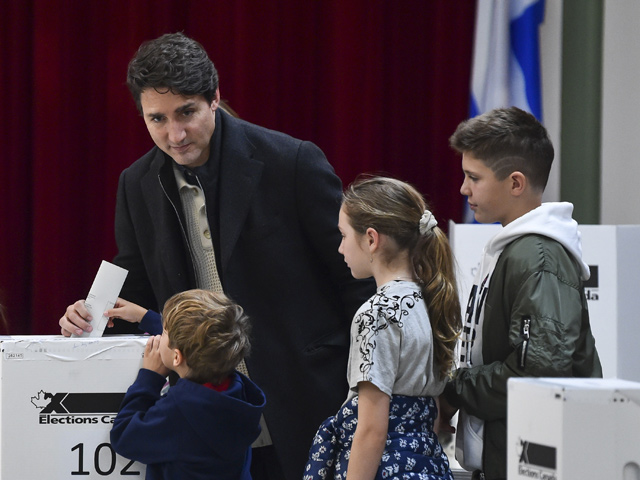 Canadian Prime Minister Justin Trudeau is surrounded by his family as he casts his vote on election day at a polling station in Montreal, Canada, on Monday (AFP photo)
