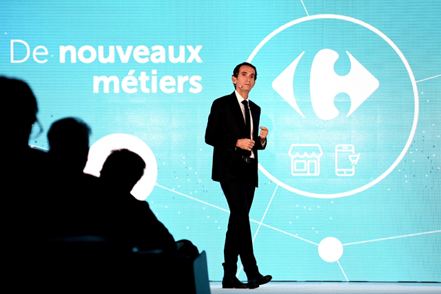 French retail company Carrefour's CEO Alexandre Bompard speaks during the presentation of the company's strategic plan 'Carrefour 2026' at the Carrefour headquarters in Massy, south of Paris, on Tuesday (AFP photo)