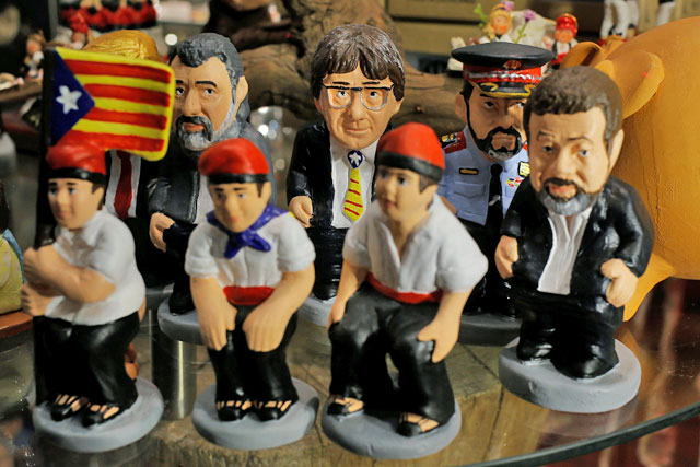 ‘Caganer’, figurines depicted in the act of defecation and traditionally included in nativity scenes in Catalonia, are seen in a shop in Barcelona, Spain, on Friday  (AFP photo)