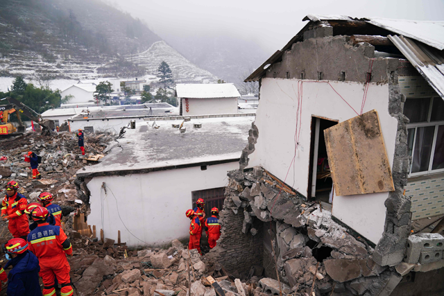 Rescue workers search for missing victims at a landslide site, a day after a landslide hits Liangshui village in Zhaotong, in south-western China’s Yunnan province on Tuesday (AFP photo)