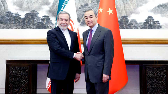 Chinese Foreign Minister Wang Yi met with his Iranian counterpart Seyyed Abbas Araghchi in Beijing on Saturday (AFP photo)