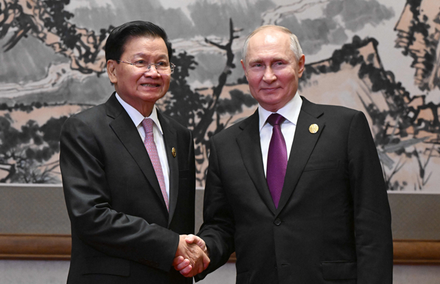 This pool photograph distributed by Russian state owned agency Sputnik shows Russia’s President Vladimir Putin meeting with Laos’ President Thongloun Sisoulith on the sidelines of the Third Belt and Road Forum in Beijing on Tuesday (AFP photo)
