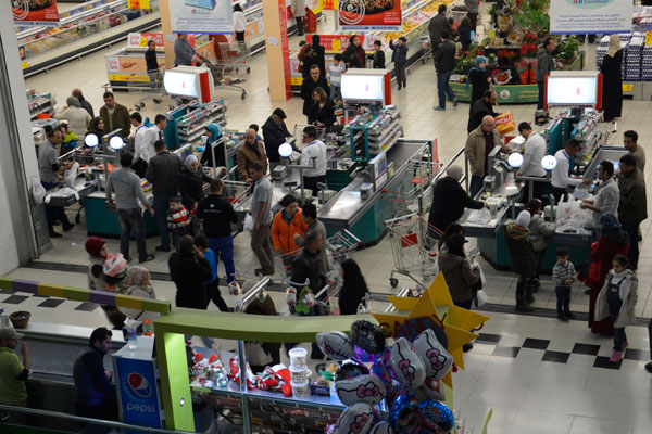 Consumers shop at a hypermarket in Amman recently (Photo by Amjad Ghsoun)