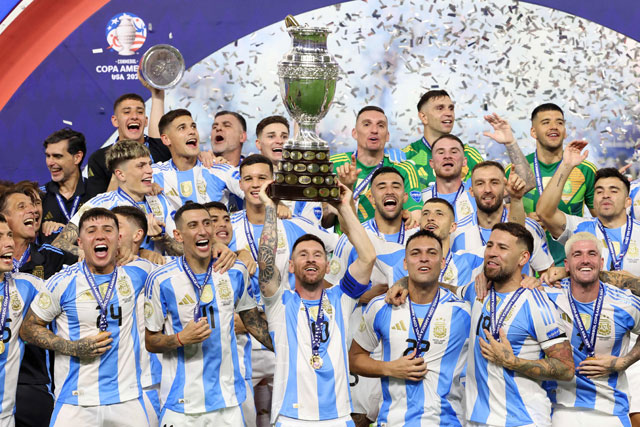 Argentina’s forward #10 Lionel Messi lifts up the trophy as he celebrates winning the Conmebol 2024 Copa America tournament final football match between Argentina and Colombia at the Hard Rock Stadium, in Miami, Florida, on Monday (AFP photo)