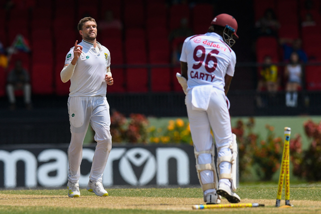 Wiaan Mulder (left) of South Africa celebrates the dismissal of Keacy Carty  of West Indies during Day 3 of the 2nd Test match between West Indies and South Africa at Guyana National Stadium in Providence, Guyana, on Saturday (AFP photo)