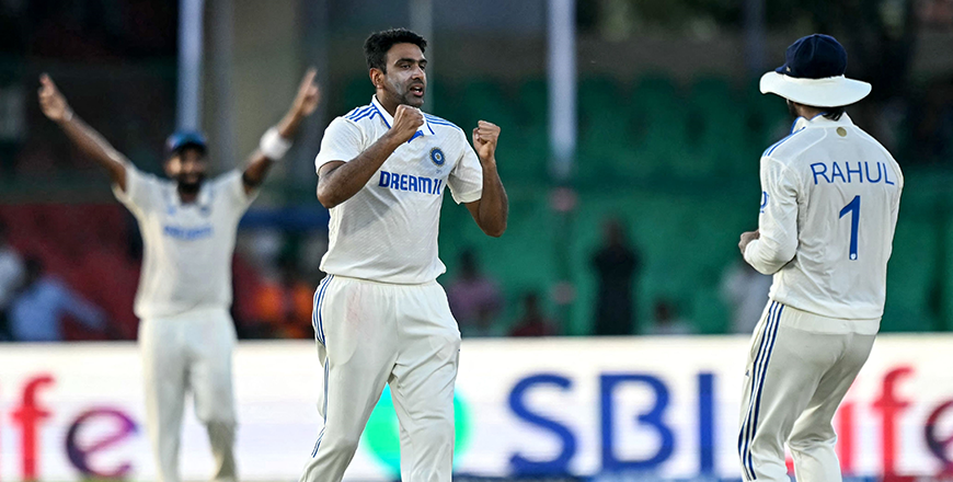 India’s Ravichandran Ashwin celebrates with teammate KL Rahul (right) after taking the wicket of Bangladesh’s Zakir Hasan during the fourth day of the second Test cricket match between India and Bangladesh at the Green Park Stadium in Kanpur on Monday (AFP photo)