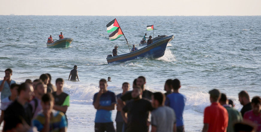 Palestinians protest to demand the lift of the Israeli blockade on Gaza on a beach in Beit Lahiya near the maritime border with Israel on September 10 (AFP photo)