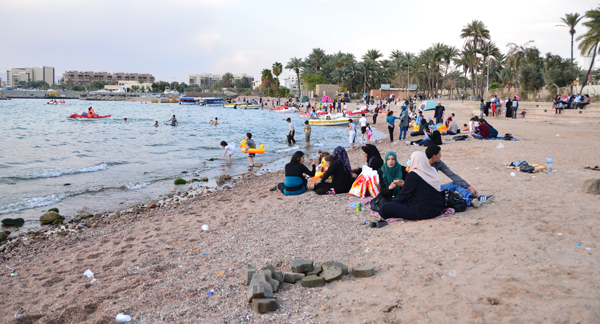 In this undated file photo, vacationers enjoy the beach in Aqaba. Around 50,000 spent the Eid Al Adha holiday in the port city (Photo by Muath Freij)