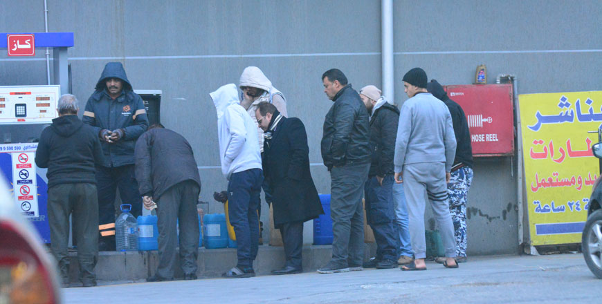 People stock up on gasoline on Sunday ahead of more rain and possibly snow later this week in Amman  (Photo by Amjad Ghousn)