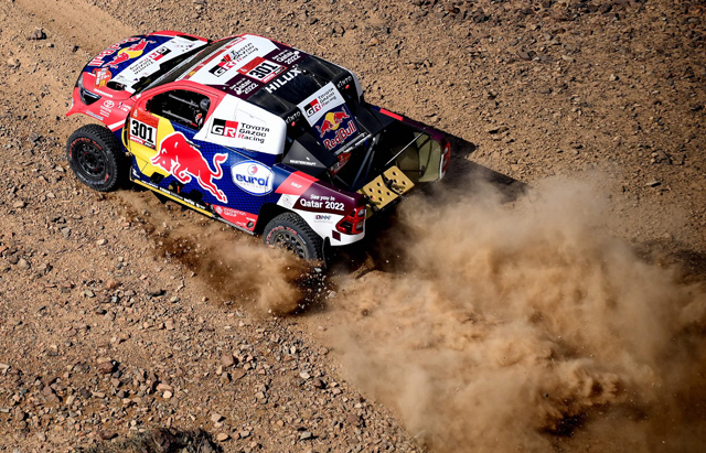 Toyota's driver Nasser Al Attiyah of Qatar (right) and his co-driver Mathieu Baumel of France compete during the prologue near the Saudi city of Jeddah, on the eve of the 2021 Dakar Rally, on Saturday (AFP photo)