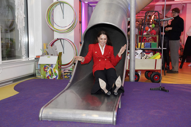 Britain’s Catherine, Duchess of Cambridge, slides as she visits the Lego Foundation PlayLab on Campus Carlsberg, Copenhagen on Tuesday, as part of her two-day visit to Denmark  (AFP photo)