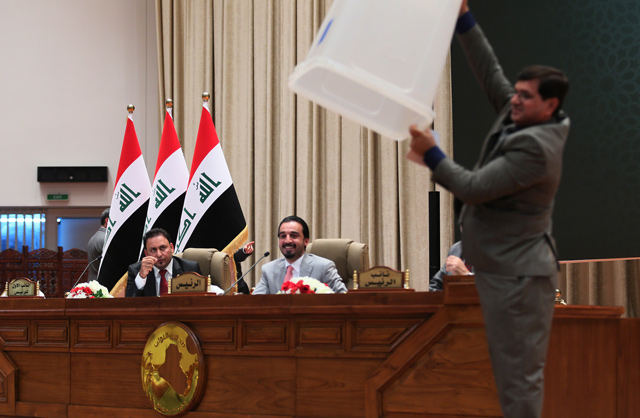 Iraqi Parliament Speaker Mohammed Al Halbusi heads a session of the parliament in which Iraqi MPs elected a new president, on Tuesday (AFP photo)