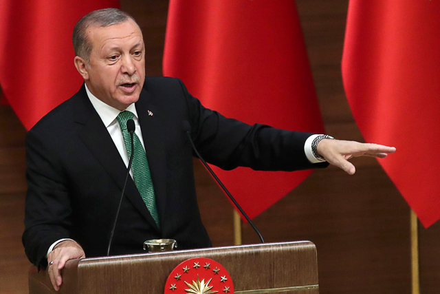 Turkish President Recep Tayyip Erdogan gestures as he sepaks during the 39th Mukhtars Meeting, at Presidential Complex in Ankara, on Tuesday (AFP photo)