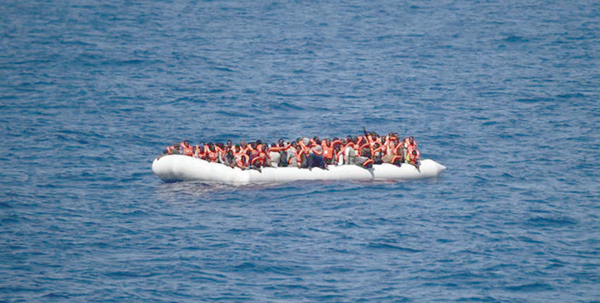 This file photo taken on May 24, 2016, shows refugees waiting on a rubber boat to be rescued during an operation in Mediterranean (AFP photo)