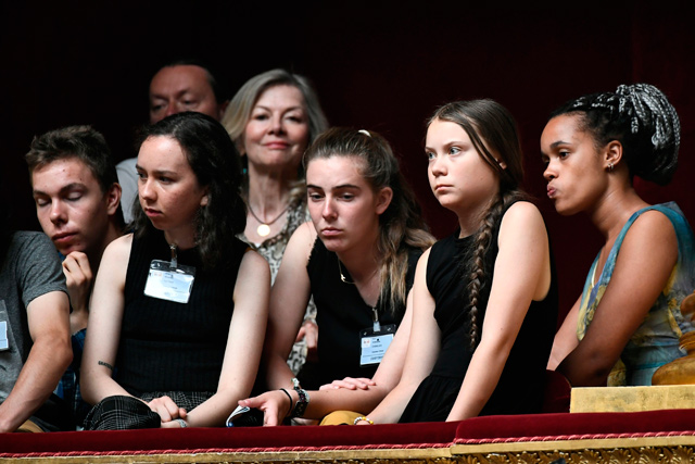 Swedish climate activist Greta Thunberg (second right) attends a session of questions to the government at the French national assembly in Paris on Tuesday (AFP photo)