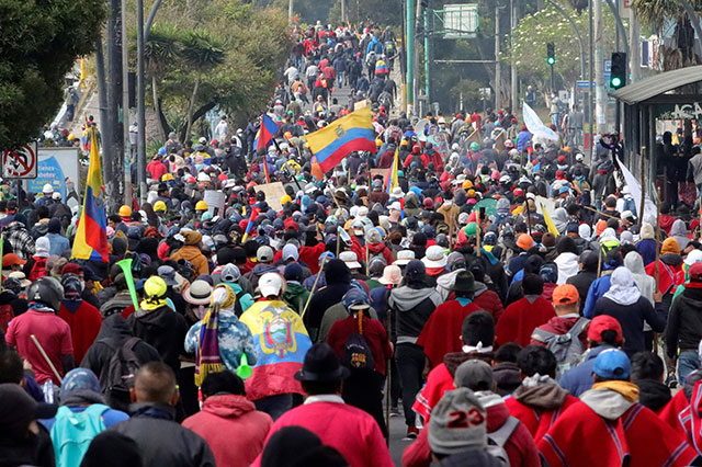 Indigenous people march towards the Central University of Ecuador in Quito, on Wednesday (AFP photo)