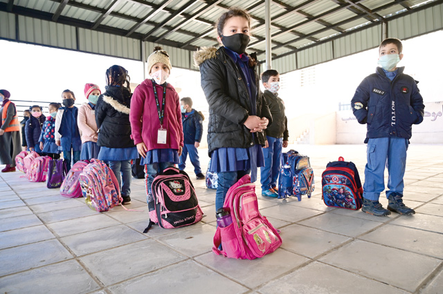 Students are seen attending the morning assembly at a school in Amman on Sunday (Photo by Amjad Ghsoun)
