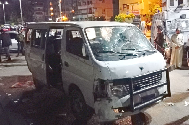 A picture taken in the early hours of Sunday shows a damaged vehicle following a gun attack on Egyptian policemen in Cairo’s southern outskirts (AFP photo)