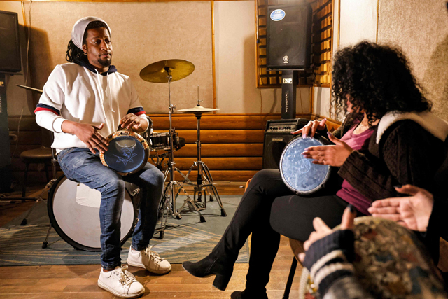 ‘Tabla’ drum instructor Mostafa Bakkar (left) gives a lesson at his studio in Egypt’s capital Cairo on March 28  (AFP photo)