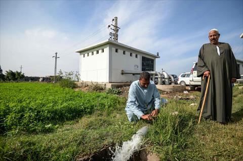 Farmers observe water pumping in Kafr Al Dawar village in northern Egypt's Nile Delta, on November 26 (AFP photo)