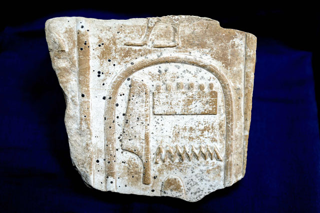 This handout photo released by the Egyptian ministry of antiquities on Wednesday, shows an ancient Egyptian relief which was previously on display in the Temple of Karnak in Luxor with a carved cartouche fragment of King Amonhotep I of the 18th dynasty (16th-13th century BC), recovered from the United Kingdom in September 2018 after it was stolen, smuggled out of Egypt, and put up on display at an auction house in London (AFP photo)