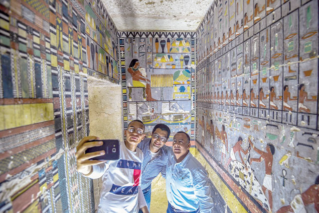 This photo, taken on Saturday inside the newly-dicovered tomb of the ancient Egyptian nobleman ‘Khewy’ dating back to the Fifth Dynasty (2,494-2,345 BC), at the Saqqara necropolis, about 35km south of the capital Cairo, shows Mohamed Mujahid, head of the Egyptian mission which discovered the tomb, posing for a ‘selfie’ (AFP photo)