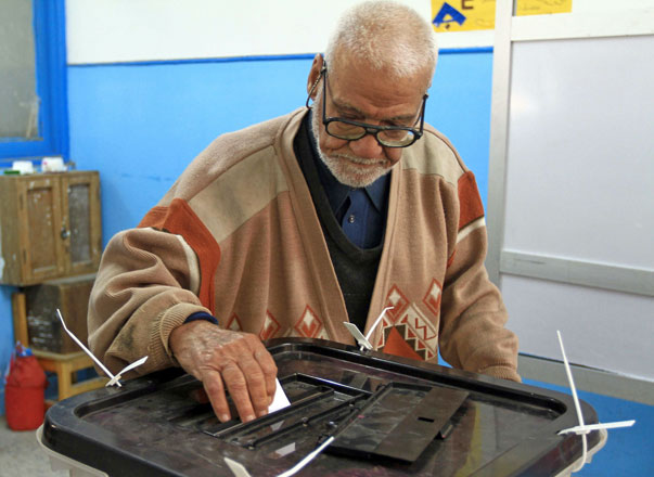 An Egyptian man casts his vote at a polling station in the Mediterranean port city of Alexandria as Egyptians continue to take part in a referendum on constitutional amendments on the second day of a three-day poll, on Sunday (AFP photo)