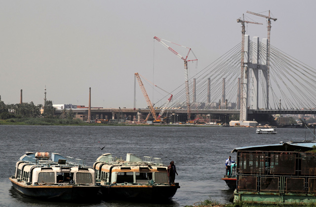 River buses park in front the new suspension bridge crossing the River Nile and named the ‘Long Live Egypt’ Bridge, part of Rawd Al Faraj Axis project, near Cairo’s Warraq Island, Egypt, on Wednesday (Reuters photo)