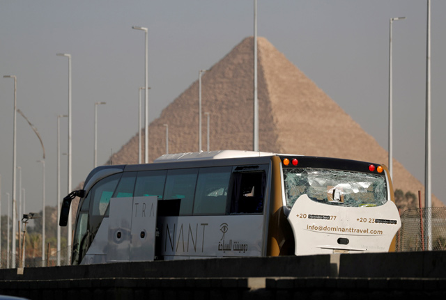 A damaged bus is seen at the site of a blast near a new museum being built close to the Giza pyramids in Cairo, Egypt, on Sunday  (Reuters photo)
