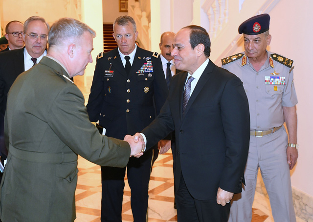 This handout photo released by the Egyptian Presidency on Tuesday shows Egyptian President Abdel Fattah Al Sisi (centre-right) shaking hands with US Marine Corps General Kenneth F. McKenzie Jr. (left), commander of the US Central Command (USCENTCOM), as Sisi and Defence Minister General Mohamed Zaki (right) receive the General at the presidential palace in the capital Cairo  (AFP photo)