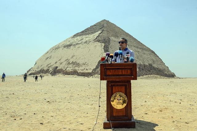 Egypt’s Antiquities Minister Khaled Al Enani speaks in front of the Bent Pyramid of Sneferu during an inaugural ceremony of the pyramid and its satellites on Saturday (AFP photo)