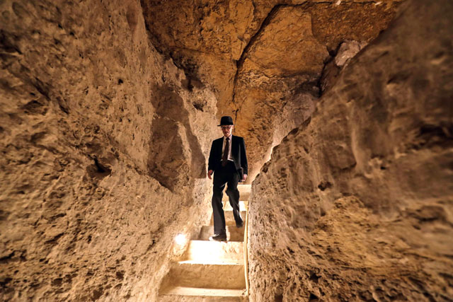 A tourist walks inside the step pyramid of Djoser in Egypt’s Saqqara necropolis, south of the capital Cairo, on Thursday (AFP photo)