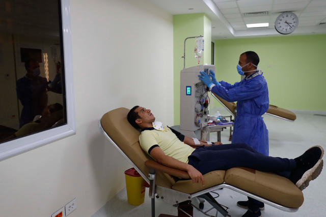 This  Egyptian man who recovered from COVID-19 donates blood at the National Blood Transfusion centre in Cairo on July 22 (AFP photo)