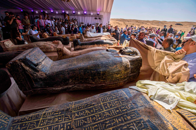 This photo taken on Saturday shows sarcophaguses, excavated by the Egyptian archaeological mission, displayed during a press conference at the Saqqara necropolis, 30 km south of the Egyptian capital Cairo, which resulted in the discovery of a deep burial well with more than 59 human coffins closed for more than 2,500 years (AFP photo)