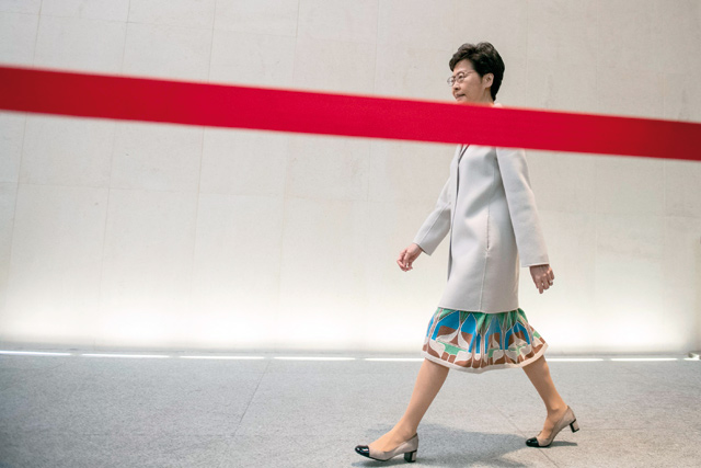 Hong Kong Chief Executive Carrie Lam arrives for a press conference in Hong Kong on Tuesday (AFP photo)  