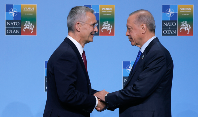 NATO Secretary-General Jens Stoltenberg (left) shakes hands with Turkey’s President Recep Tayyip Erdogan as he arrives for the NATO Summit in Vilnius, Lithuania, on July 11 (AFP photo)