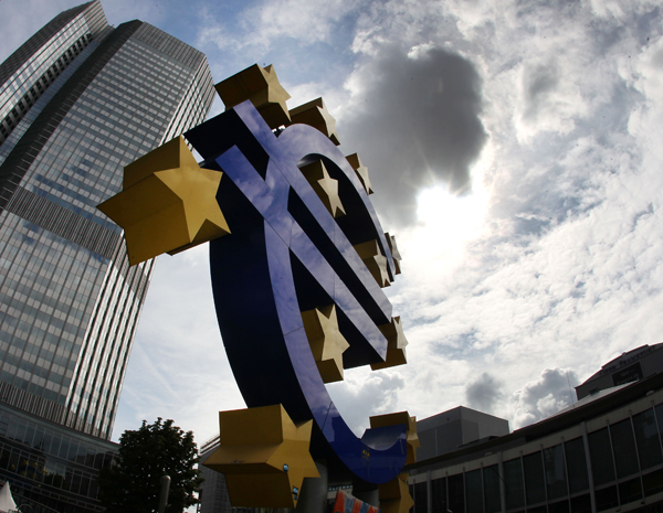 This July 31, 2012 file photo shows the euro sculpture in front of the headquarters of the European Central Bank in Frankfurt, Germany (AP photo)