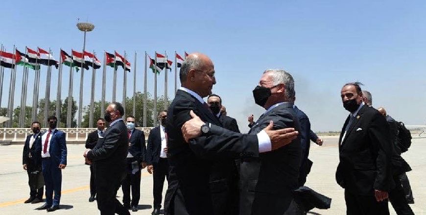 His Majesty King Abdullah is received by Iraqi President Barham Salih upon arrival at Baghdad International Airport on Sunday (Photo courtesy of Royal Court)