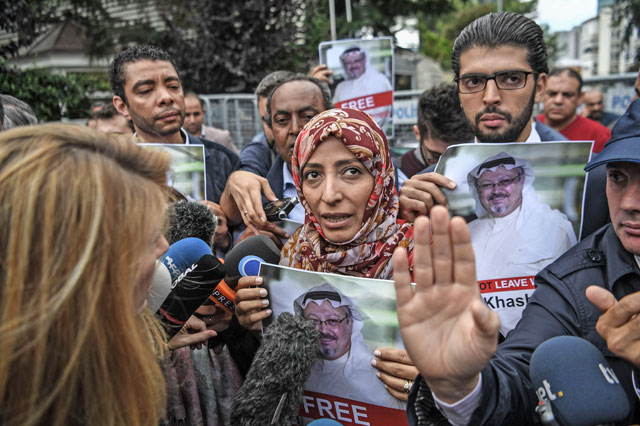 Nobel Peace Prize laureate Yemeni Tawakkol Karman (centre) holds pictures of missing journalist Jamal Khashoggi as she speaks to the press during a demonstration in front of the Saudi Arabian consulate in Istanbul on Monday (AFP photo)