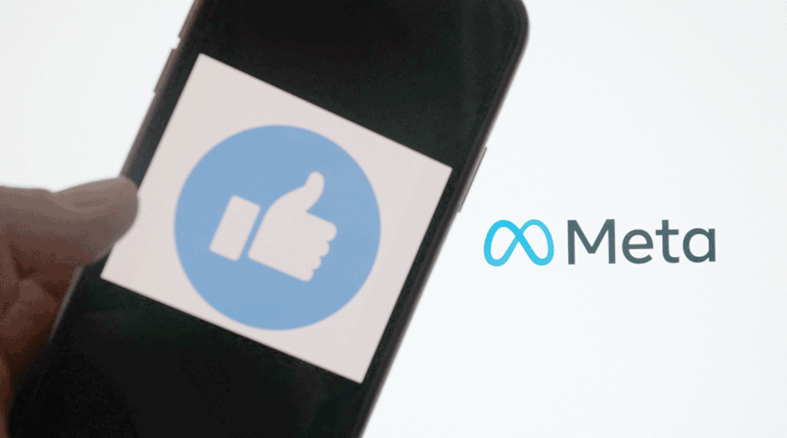 In this file photo taken on October 28, 2021, this illustration photo taken in Los Angeles shows a person using Facebook on a smartphone in front of a computer screen showing the META logo (AFP photo)