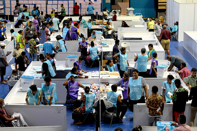 Staff of the election office and scrutineers are seen at the Fijian Elections Office National Count Centre in Suva on Thursday, after the provisional election results were released (AFP photo)