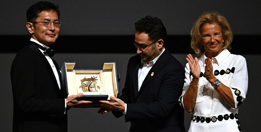 Japanese director and Ghibli Park Creative Development manager Goro Miyazaki is awarded with the Honourary Palme d’or by Juan Antonio Bayona Iris Knobloch during the 77th edition of the Cannes Film Festival in Cannes on Monday (AFP photo)