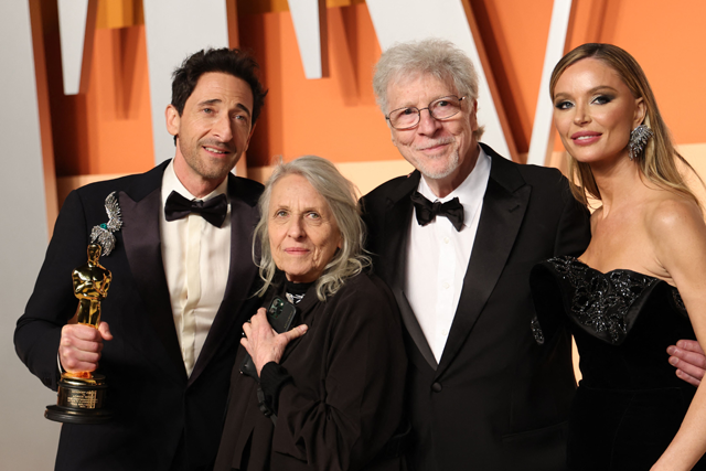 US actor Adrien Brody (left) holds the Oscar for Best Actor in a Leading Role for 'The Brutalist' next to British actress Georgina Chapman (right) and his parents Sylvia Plachy (second left) and Elliot Brody as they attend the Vanity Fair Oscar Party at the Wallis Annenberg Centre for the Performing Arts in Beverly Hills, California, on Sunday (AFP photo)