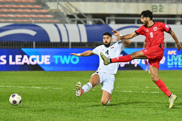 Jordan's Yazan Al Naimat (right) scores a goal during the 2026 FIFA World Cup Asian qualification football match between Jordan and Palestine at Kuala Lumpur Stadium in Kuala Lumpur on Tuesday (AFP photo)