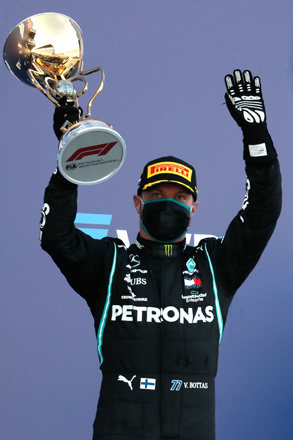 Mercedes' Finnish driver Valtteri Bottas celebrates on the podium after winning the Formula One Russian Grand Prix at the Sochi Autodrom Circuit in Sochi on Sunday (AFP photo)