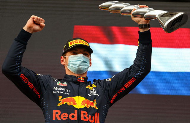 Red Bull’s Dutch driver Max Verstappen celebrates on the podium after the Emilia Romagna Formula One Grand Prix at the Autodromo Internazionale Enzo e Dino Ferrari racetrack in Imola, Italy, on Sunday  (AFP photo by Bryn Lennon)