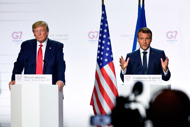 France's President Emmanuel Macron (left) and US President Donald Trump give a joint press conference in Biarritz, southwest France, on Monday (AFP photo)