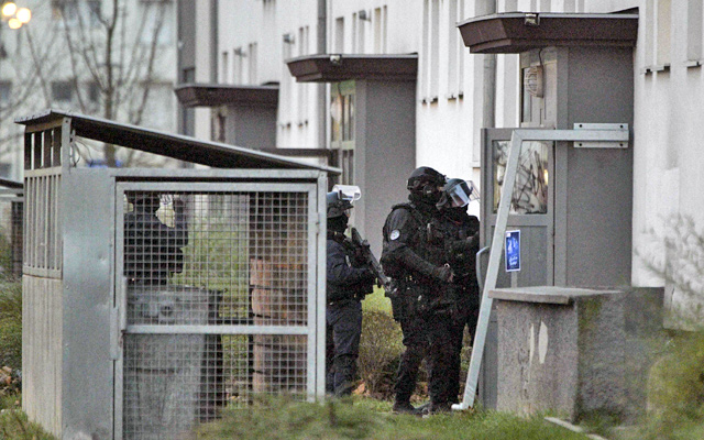 Members of the French police special forces RAID take part in an operation, on Thursday, in Strasbourg, as part of the hunt for the gunman who killed three people and injured 13 others in an attack on Strasbourg's Christmas market (AFP photo)