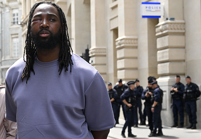 French member of the Truth and Justice for Adama Committee Youssouf Traore looks on in front of a police station of the 1st district of Paris, during a gathering to demand release of demonstrators from police custody on Sunday (AFP photo)